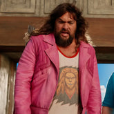 Person wearing a pink jacket and graphic t-shirt with a lion design.