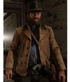 Man in a brown coat and hat standing in a dimly lit room.